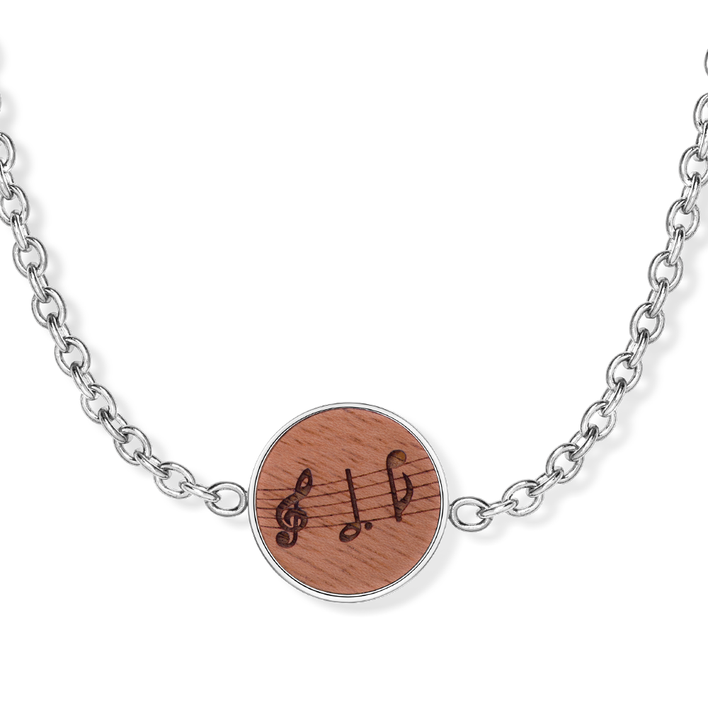 Edelstahlarmband mit rundem Holzelement und eingravierten Musiknoten.