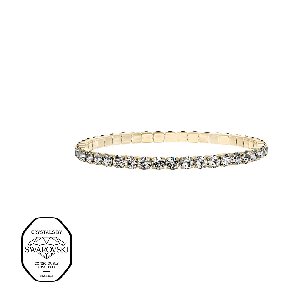 Schmales Stretcharmband mit klaren Swarovski® Kristallen in goldfarbener Fassung – elegant und vielseitig tragbar.